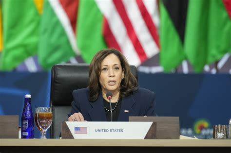 Harris in Africa looks to painful past, innovative future